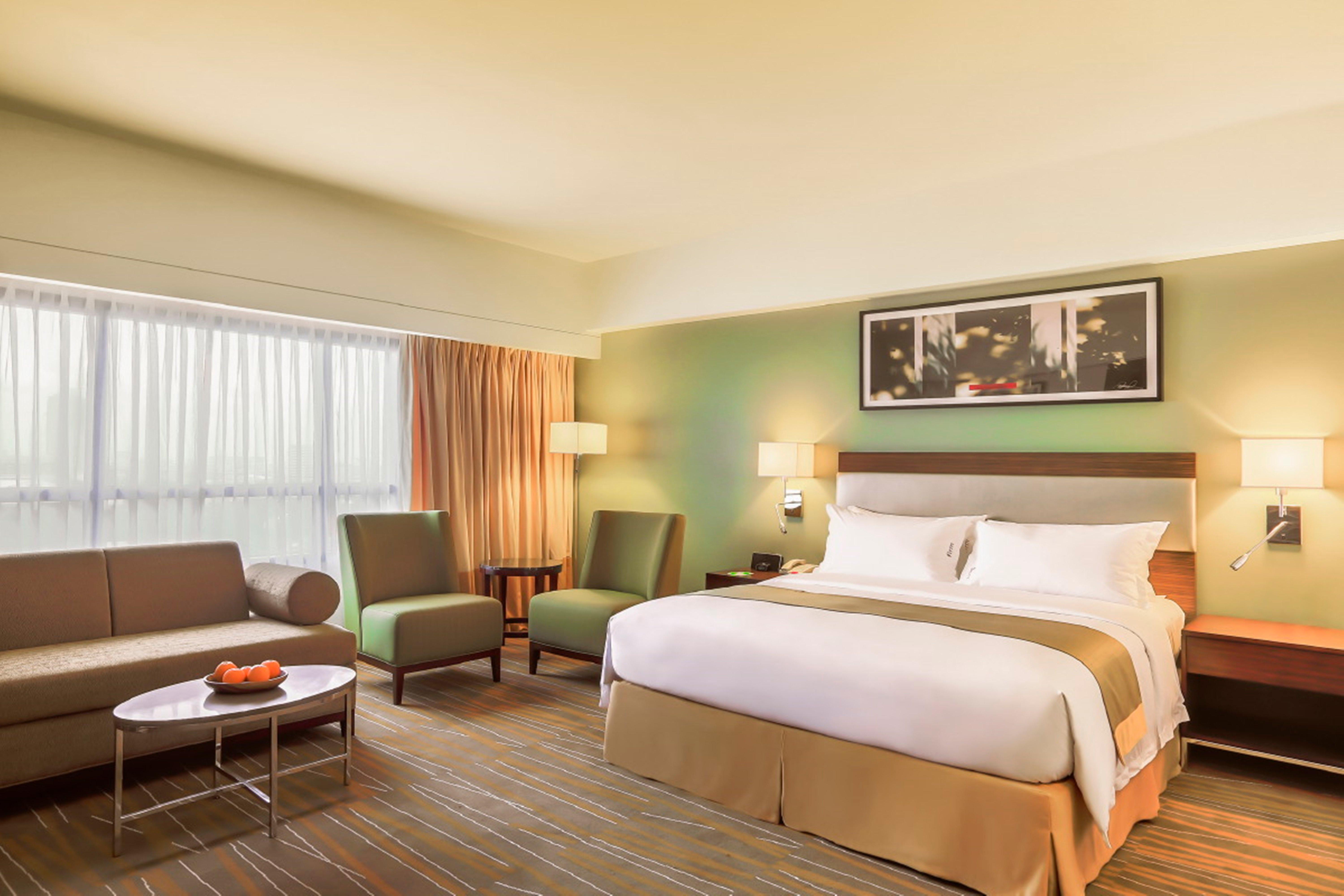 Holiday Inn & Suites Makati By Ihg Μακάτι Εξωτερικό φωτογραφία A typical room at the Holiday Inn